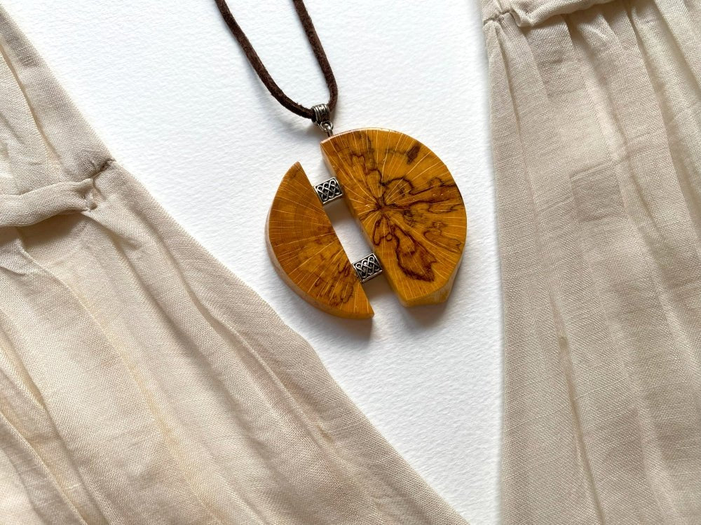 Medium size wooden pendant made from finely polished wood with silver inlays on a woven leather strap - Ornamentico shop