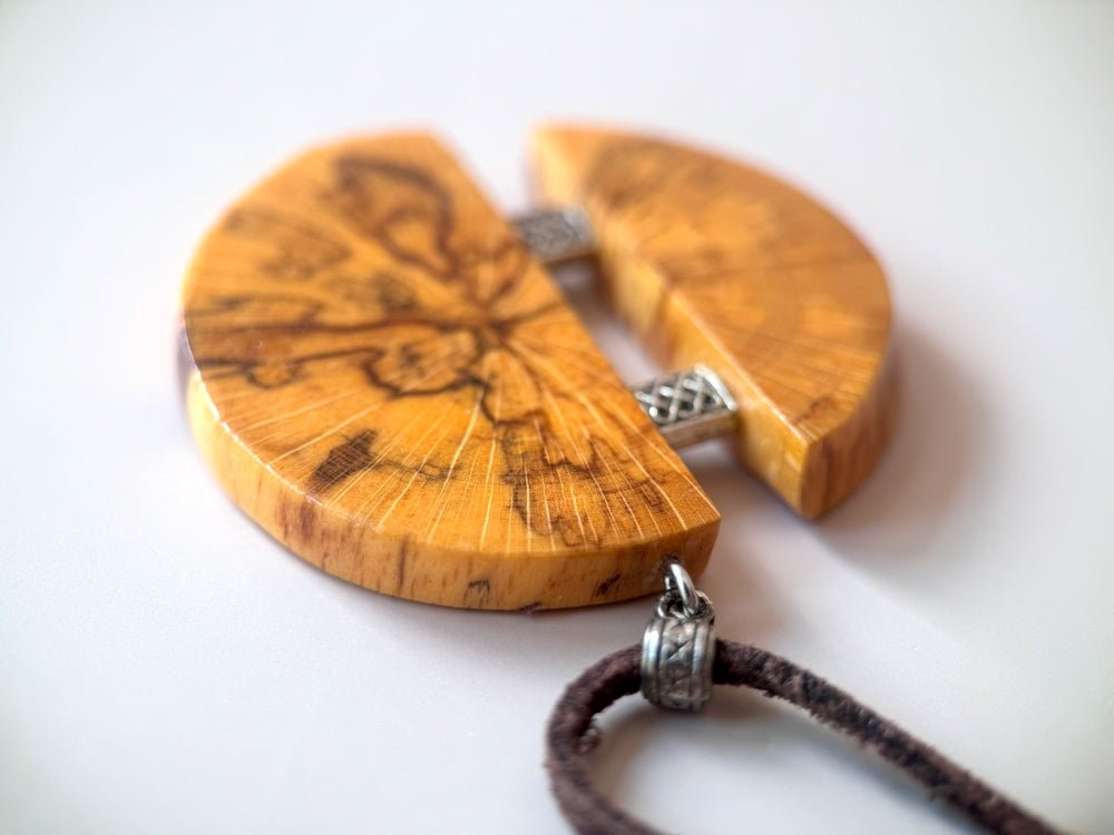 Medium size wooden pendant made from finely polished wood with silver inlays on a woven leather strap - Ornamentico shop