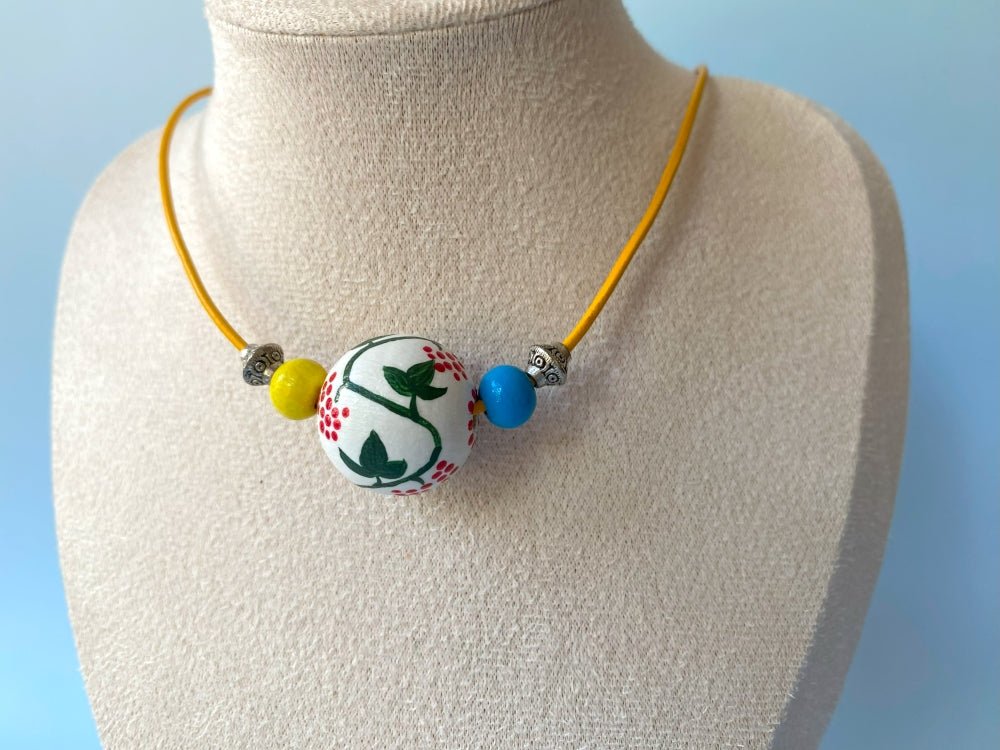 Necklace from hand painted wooden beads crafted in Boho style with beads in colors of Ukrainian flag - Ornamentico shop