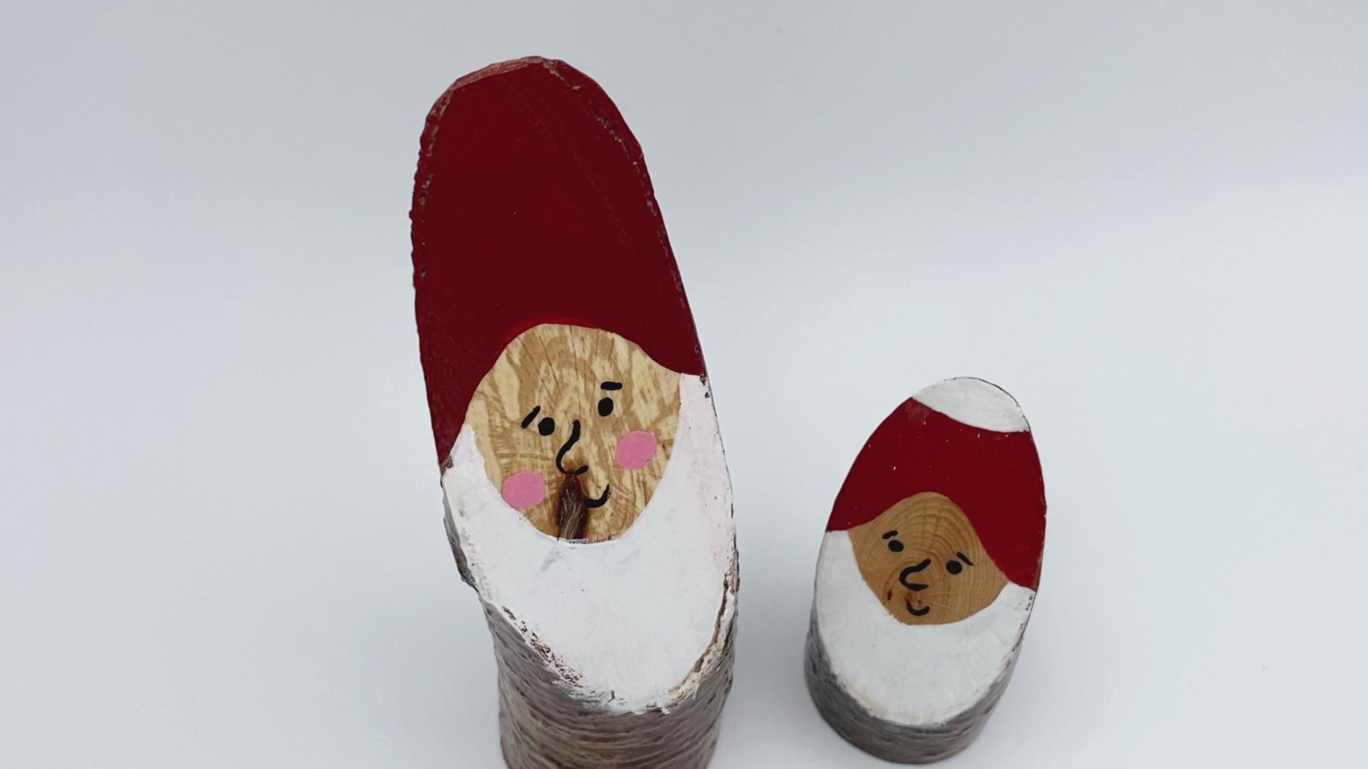 Handmade small wooden figurines of two smiling Santas - Ornamentico Shop