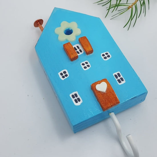 Handmade wooden hook crafted in the shape of a light blue house - Ornamentico shop