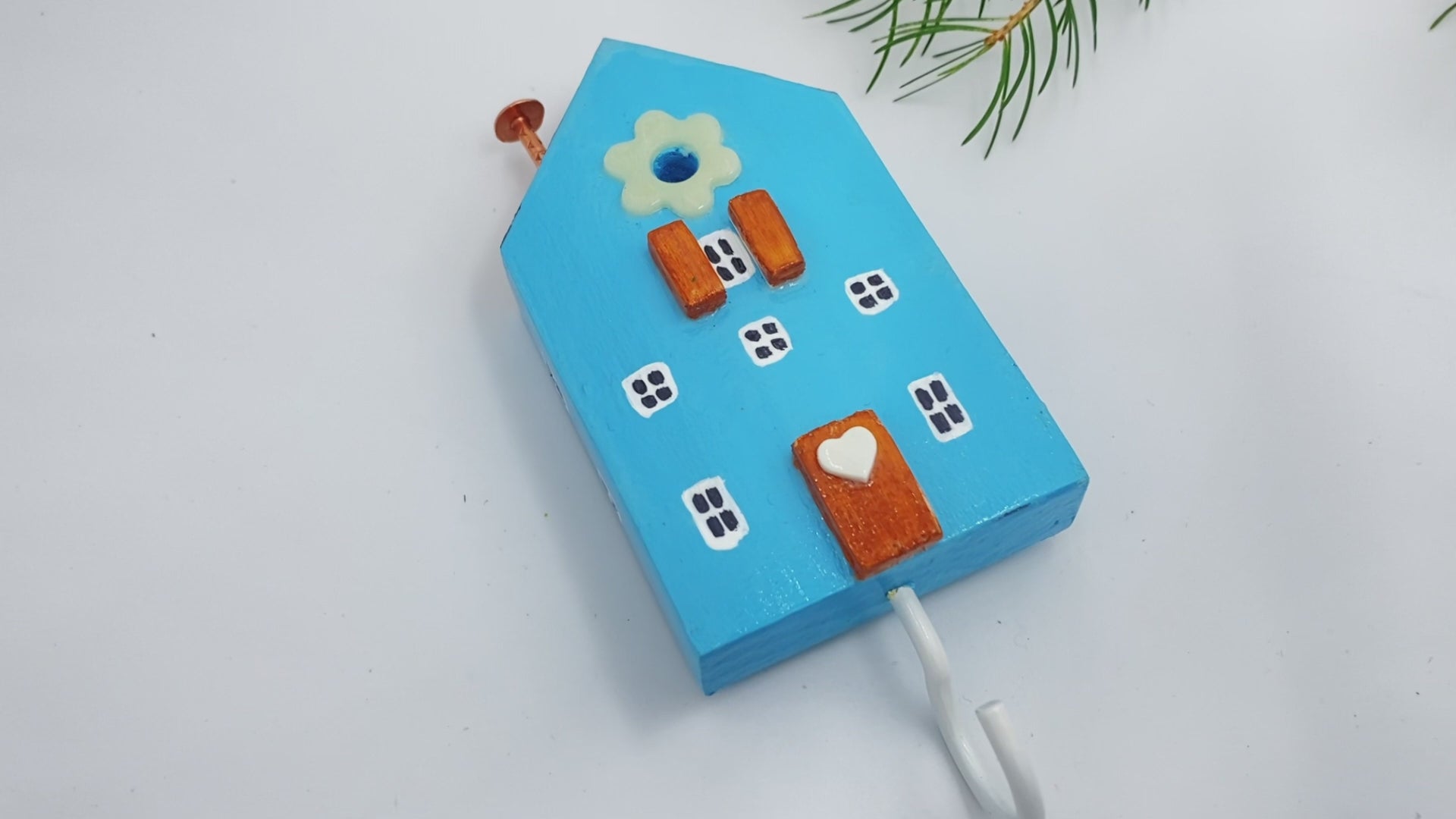 Handmade wooden hook crafted in the shape of a light blue house - Ornamentico shop