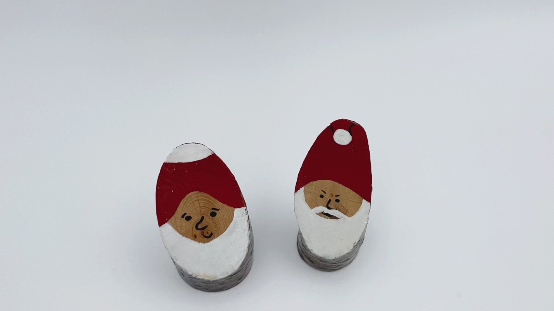 Handcrafted small wooden figurines of two Santas - Ornamentico shop