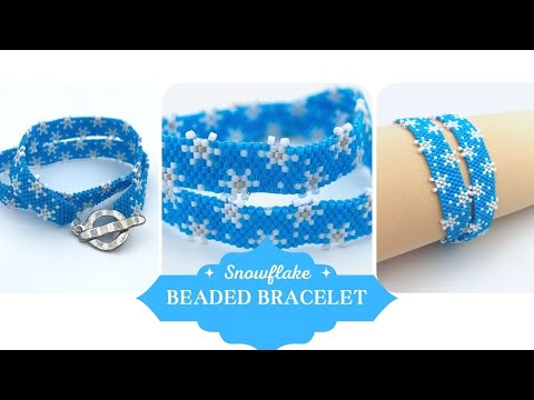 Handmade beaded bracelet featuring white snowflakes on a bright azure blue - Ornamentico shop