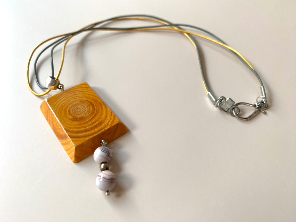 Handmade small wooden pendant crafted from beech wood. Complimented with two agate stones - Ornamentico shop