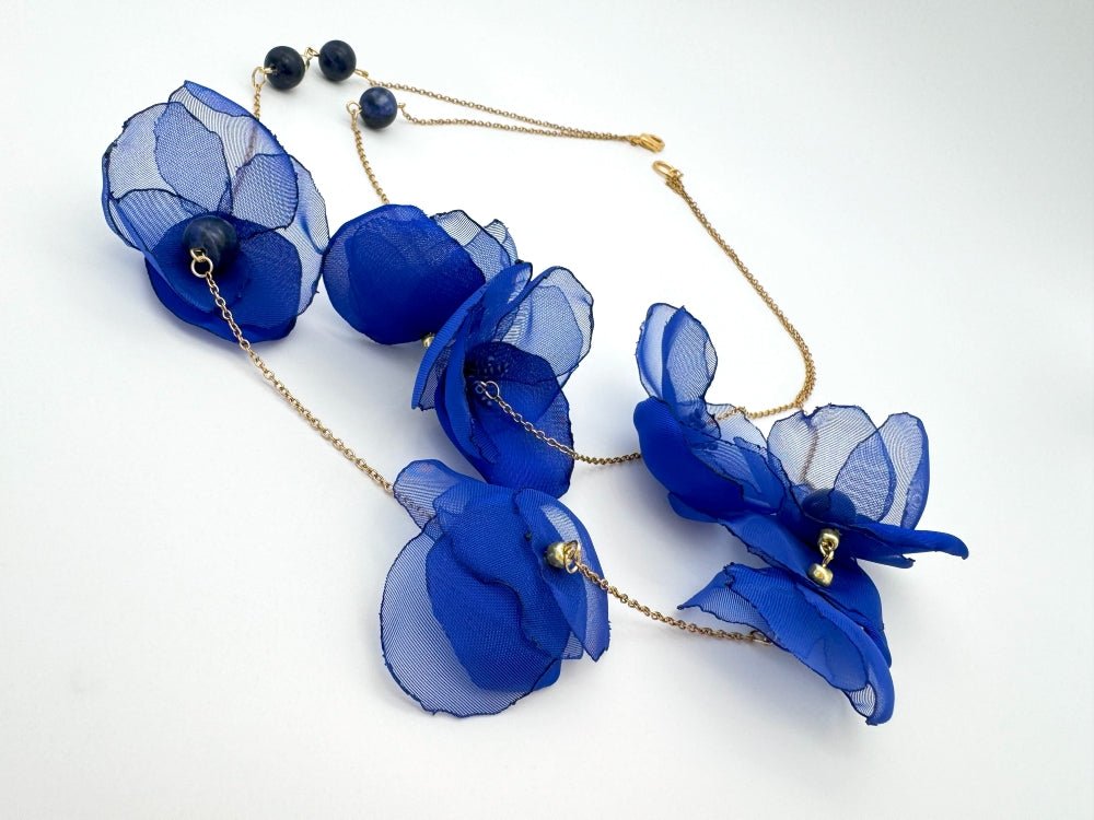 Statement floral necklace made from organza and satin flowers, beads and lapis lazuli stones