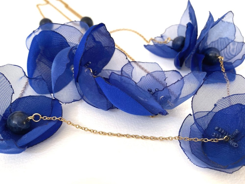 Statement floral necklace made from organza and satin flowers, beads and lapis lazuli stones