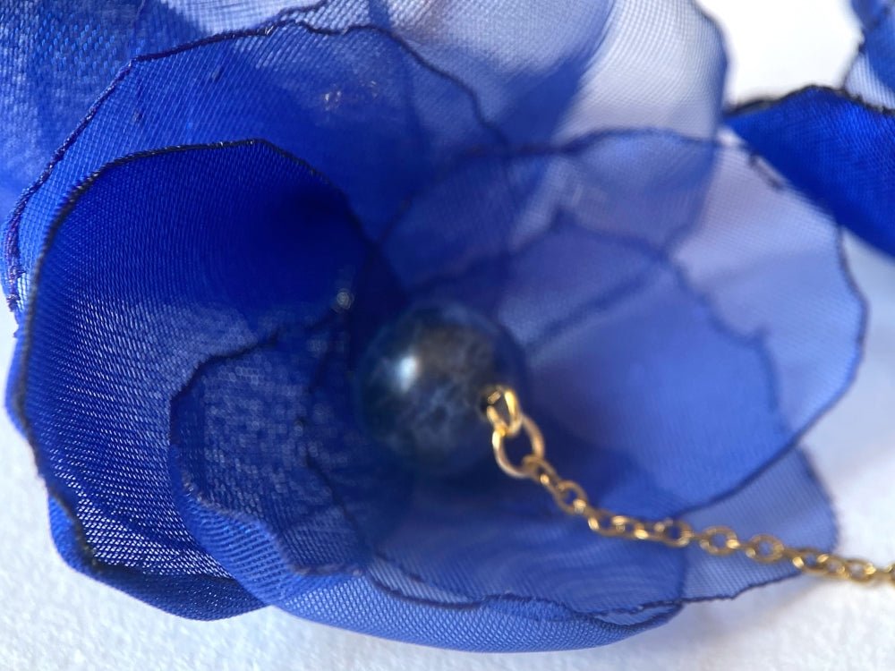 Statement floral necklace made from organza and satin flowers, beads and lapis lazuli stones