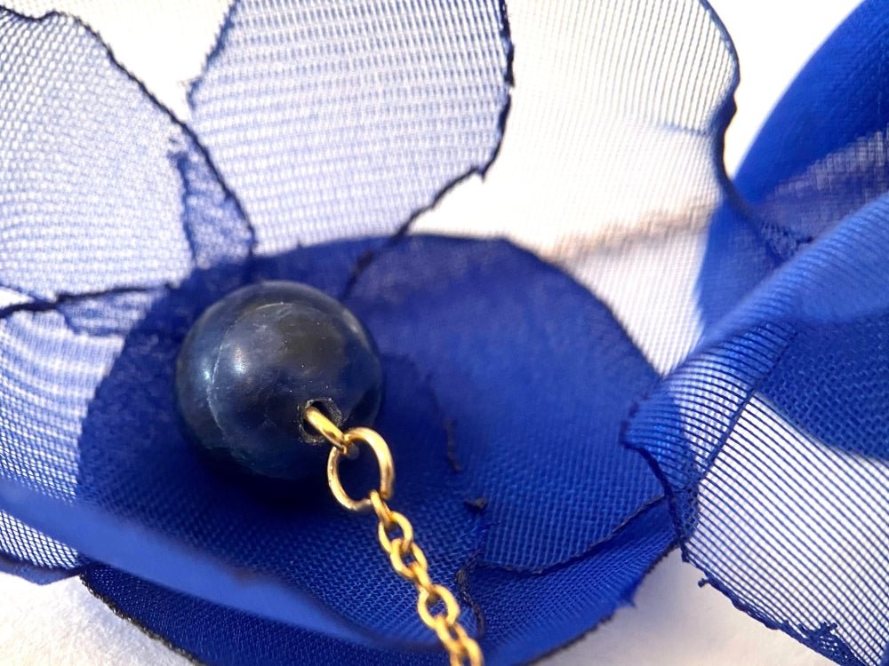 Statement floral necklace made from organza and satin flowers, beads and lapis lazuli stones
