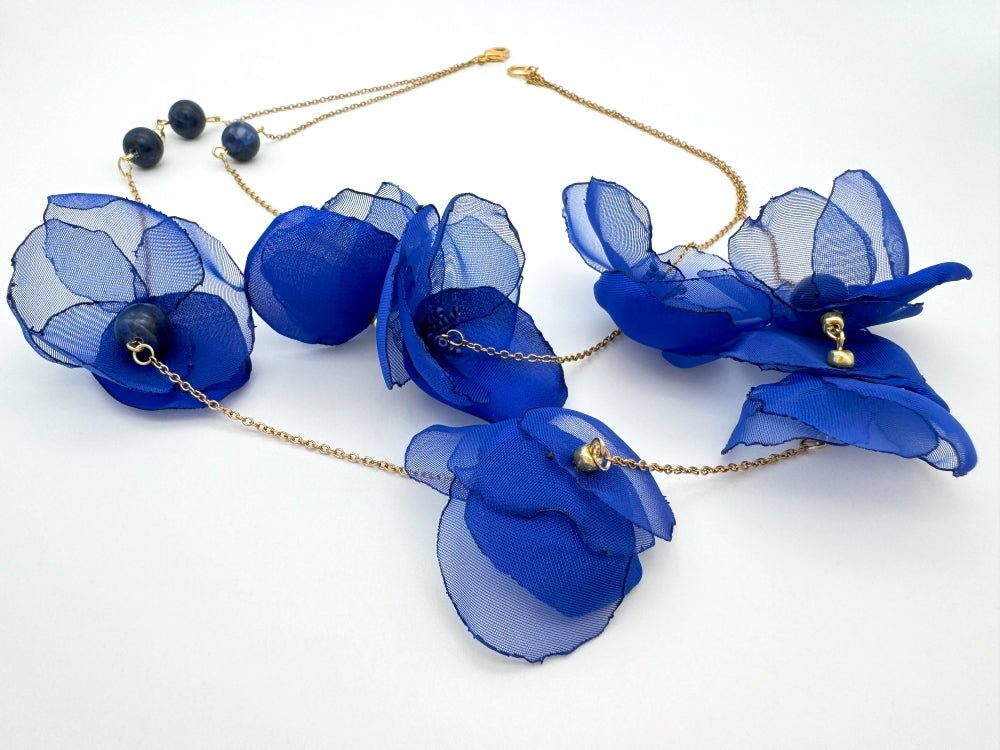 Statement floral necklace made from organza and satin flowers, beads and lapis lazuli stones