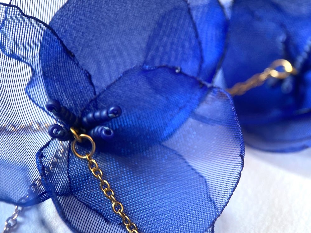 Statement floral necklace made from organza and satin flowers, beads and lapis lazuli stones