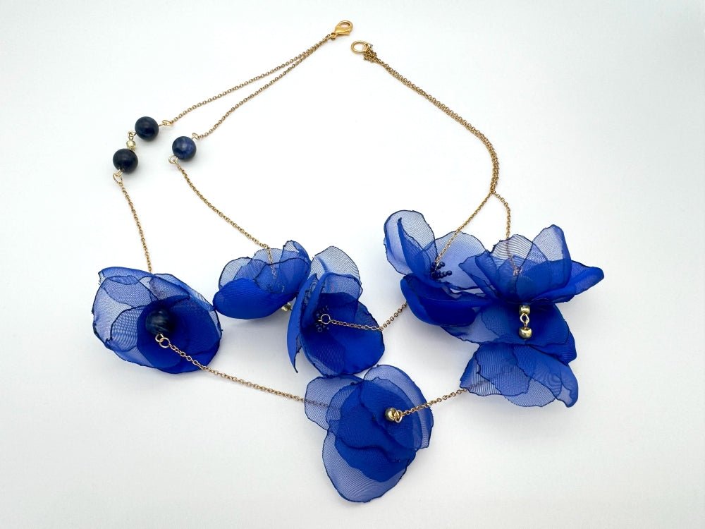 Statement floral necklace made from organza and satin flowers, beads and lapis lazuli stones