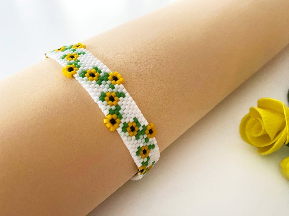 Beaded bracelet with bright sunflowers crafted in peyote stitch technique from Miyuki Delica beads
