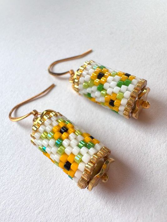 Beaded dangle earrings featuring bright sunflowers crafted in peyote stitch technique with Miyuki Delica beads
