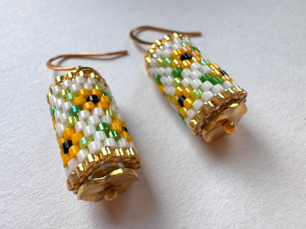 Beaded dangle earrings featuring bright sunflowers crafted in peyote stitch technique with Miyuki Delica beads