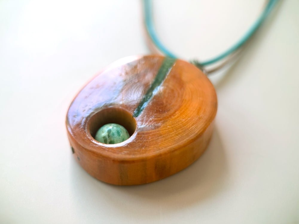 Handmade wooden pendant. Made of polished and lacquered beech wood with one Peruvian turquoise stone - Ornamentico shop