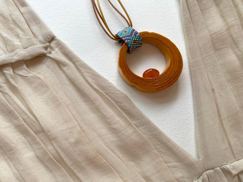 Wooden pendant with amber, crafted from polished and lacquered beech wood - Ornamentico shop