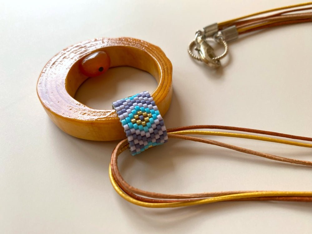 Wooden pendant with amber, crafted from polished and lacquered beech wood - Ornamentico shop