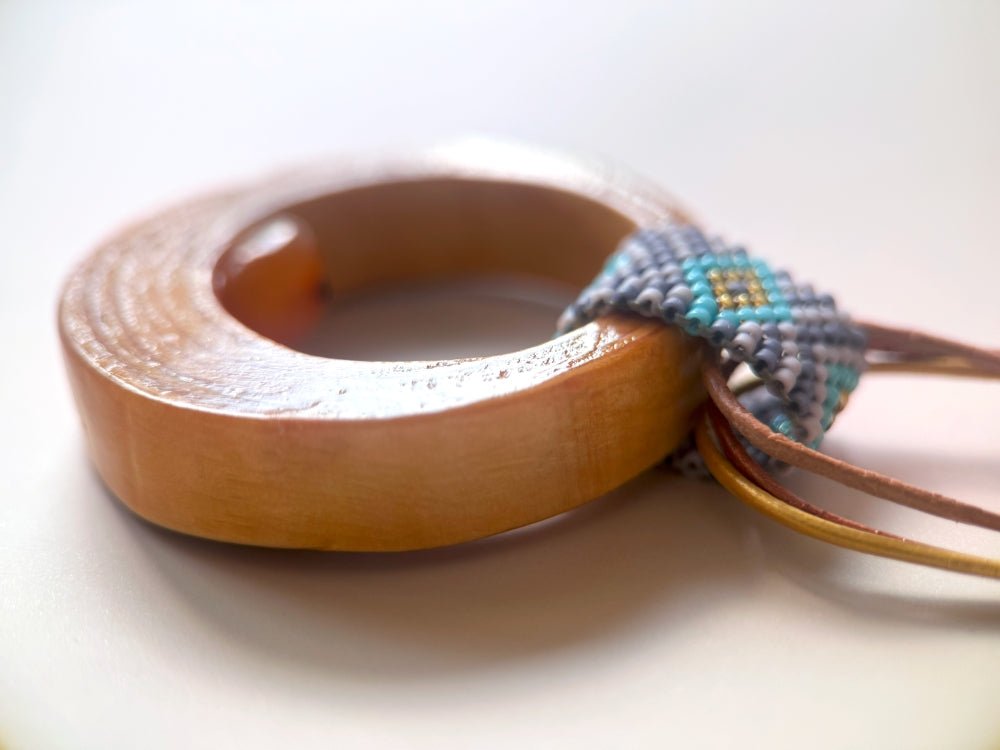 Wooden pendant with amber, crafted from polished and lacquered beech wood - Ornamentico shop