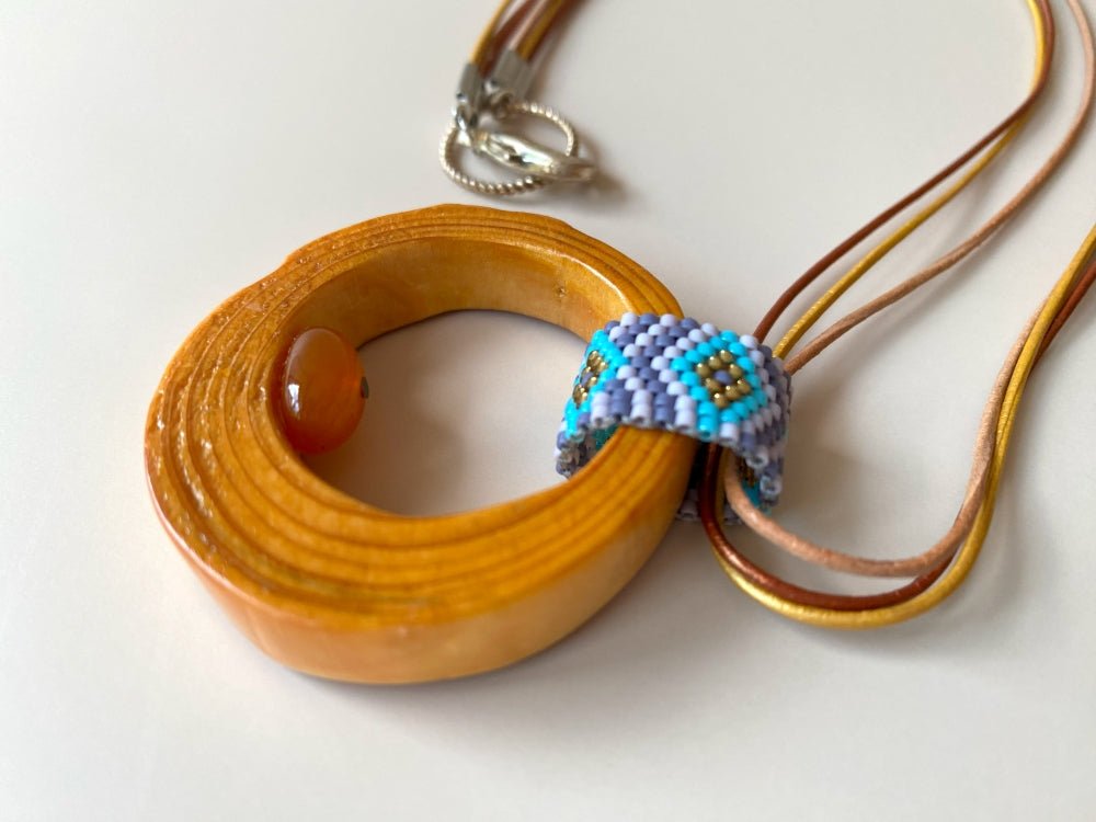 Wooden pendant with amber, crafted from polished and lacquered beech wood - Ornamentico shop