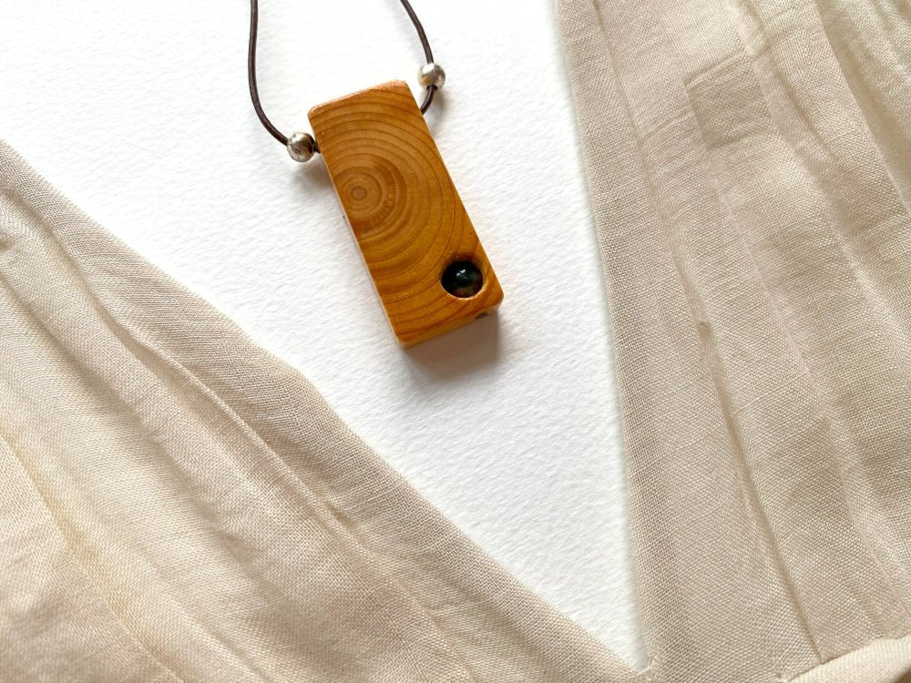 Lacquered wooden pendant with tourmaline bead. Beech wood, pink tourmaline bead, silver coated fittings - Ornamentico shop