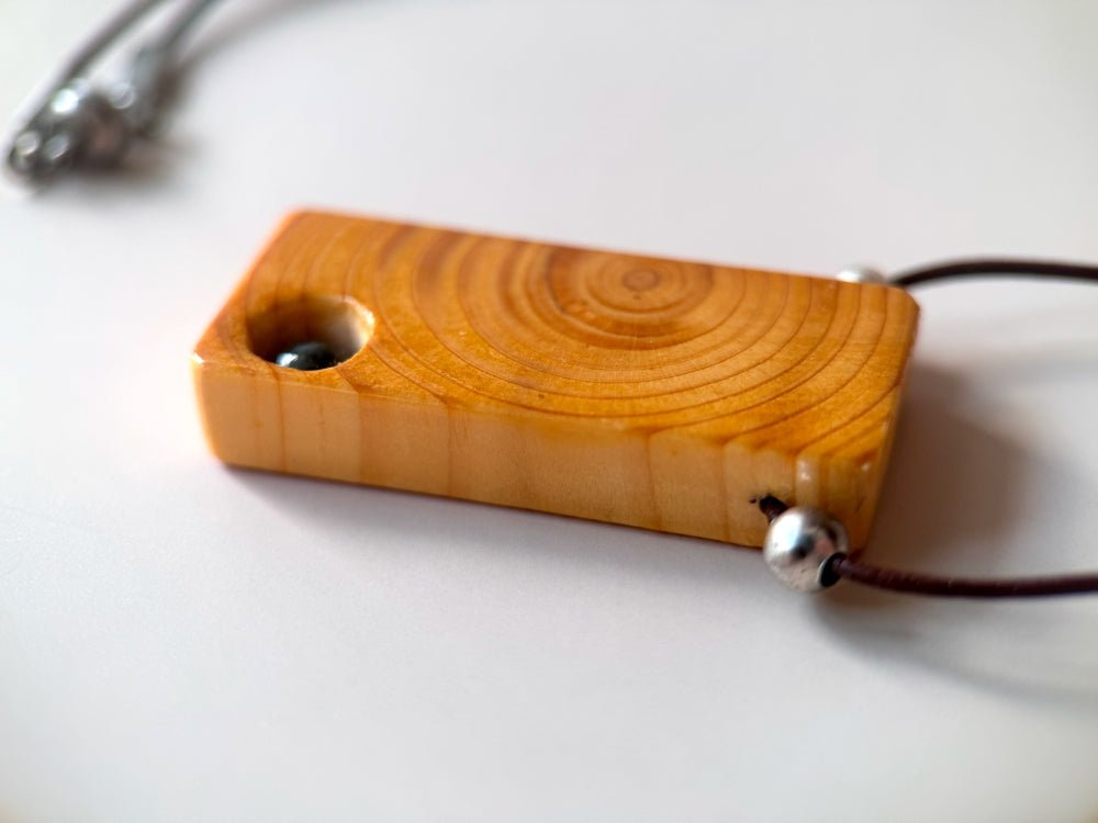 Lacquered wooden pendant with tourmaline bead. Beech wood, pink tourmaline bead, silver coated fittings - Ornamentico shop