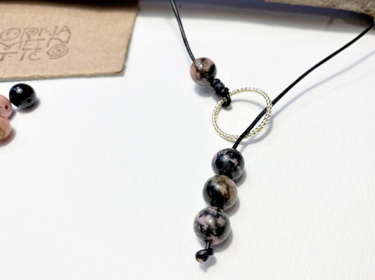 Shop the latest Lariat style necklace crafted from stunning rhodonite beads and genuine leather cord - Ornamentico shop