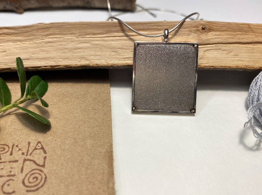 Unique pendant with delicate hand embroidery in oriental design, set in custom silver frame - Ornamentico shop