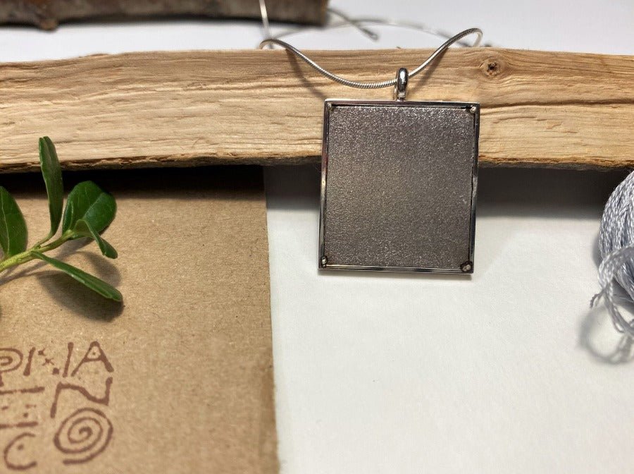 Unique hand embroidered pendant in oriental Peruvian design, set in custom silver frame - Ornamentico shop