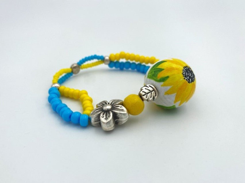 Boho style bracelet from wooden beads crafted from hand-painted wooden bead in colors of Ukrainian flag - Ornamentico shop