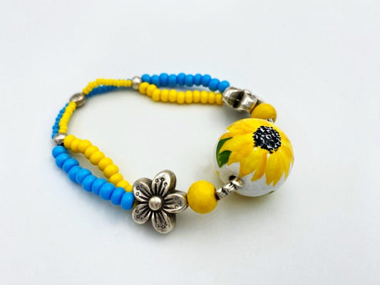 Boho style bracelet from wooden beads crafted from hand-painted wooden bead in colors of Ukrainian flag - Ornamentico shop