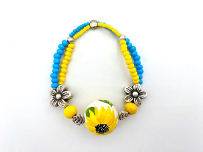 Boho style bracelet from wooden beads crafted from hand-painted wooden bead in colors of Ukrainian flag - Ornamentico shop