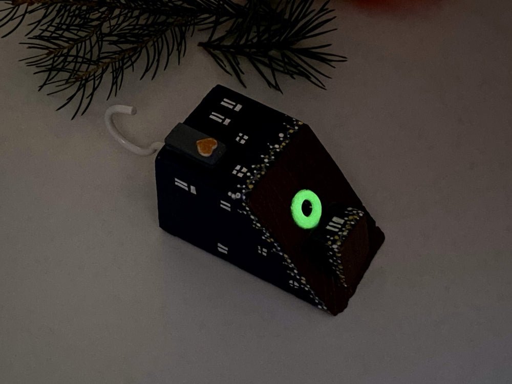 Handmade wall-mounted wooden hook in the shape of indigo blue house decorated with festive garland - Ornamentico shop