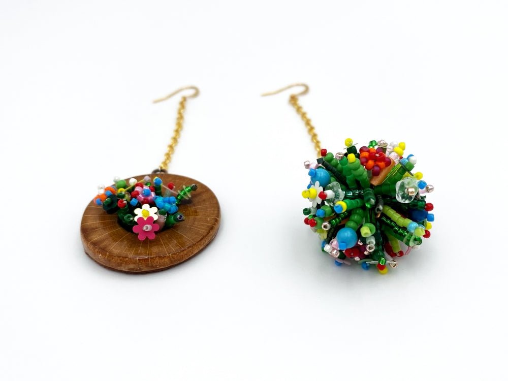 Handmade asymmetric earrings made in sculptural beading technique featuring bright floral design accented by wood - Ornamentico Group