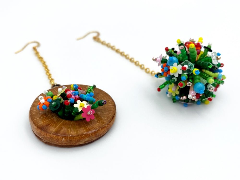Handmade asymmetric earrings made in sculptural beading technique featuring bright floral design accented by wood - Ornamentico Group