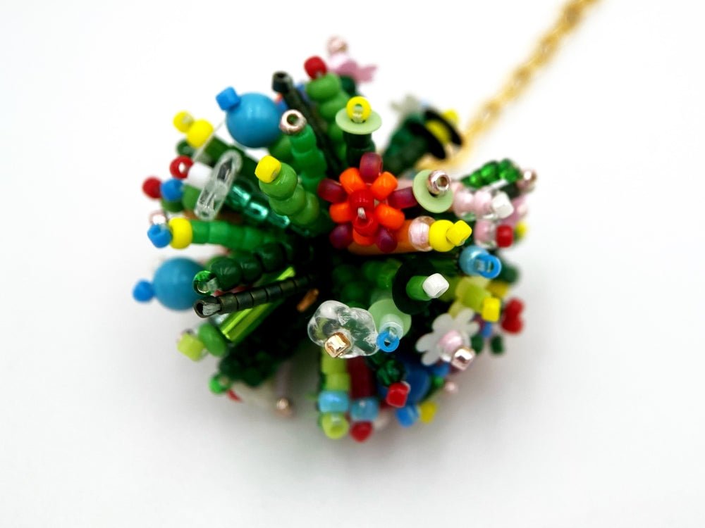 Handmade asymmetric earrings made in sculptural beading technique featuring bright floral design accented by wood - Ornamentico Group