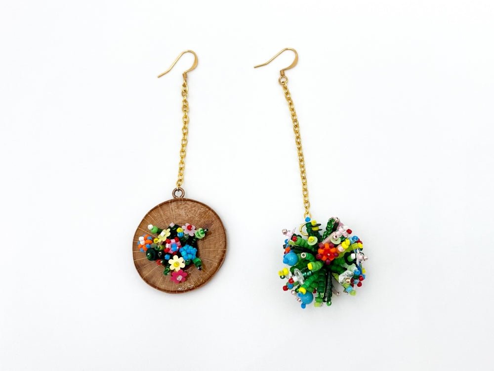 Handmade asymmetric earrings made in sculptural beading technique featuring bright floral design accented by wood - Ornamentico Group
