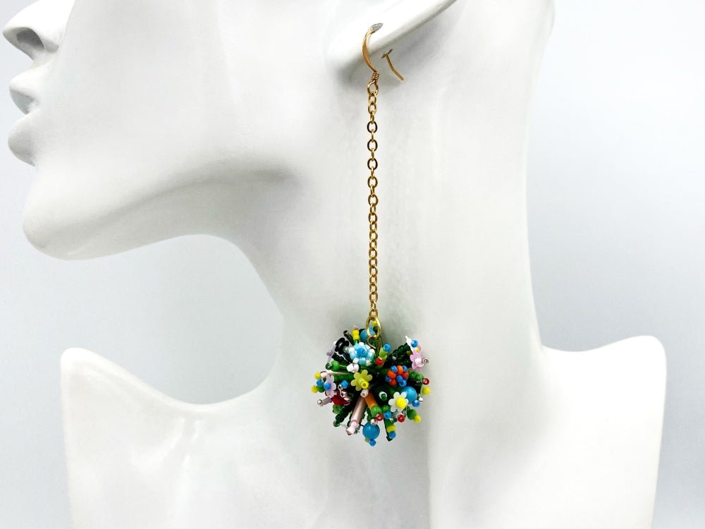 Handmade asymmetric earrings made in sculptural beading technique featuring bright floral design accented by wood - Ornamentico Group