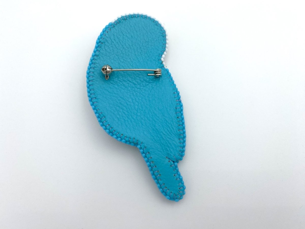 Handmade brooch in the shape of an azure blue wavy parrot made from beads and sequins - Ornamentico shop