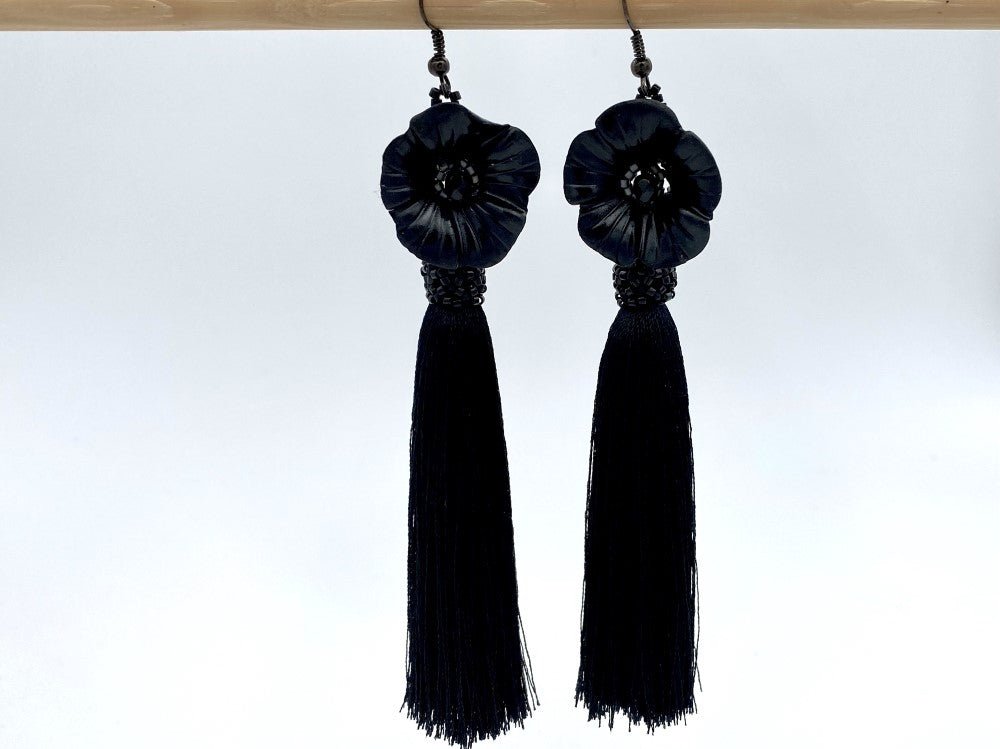Handmade earrings featuring big polymer clay flower, faceted glass beads and long rayon tassels - Ornamentico shop