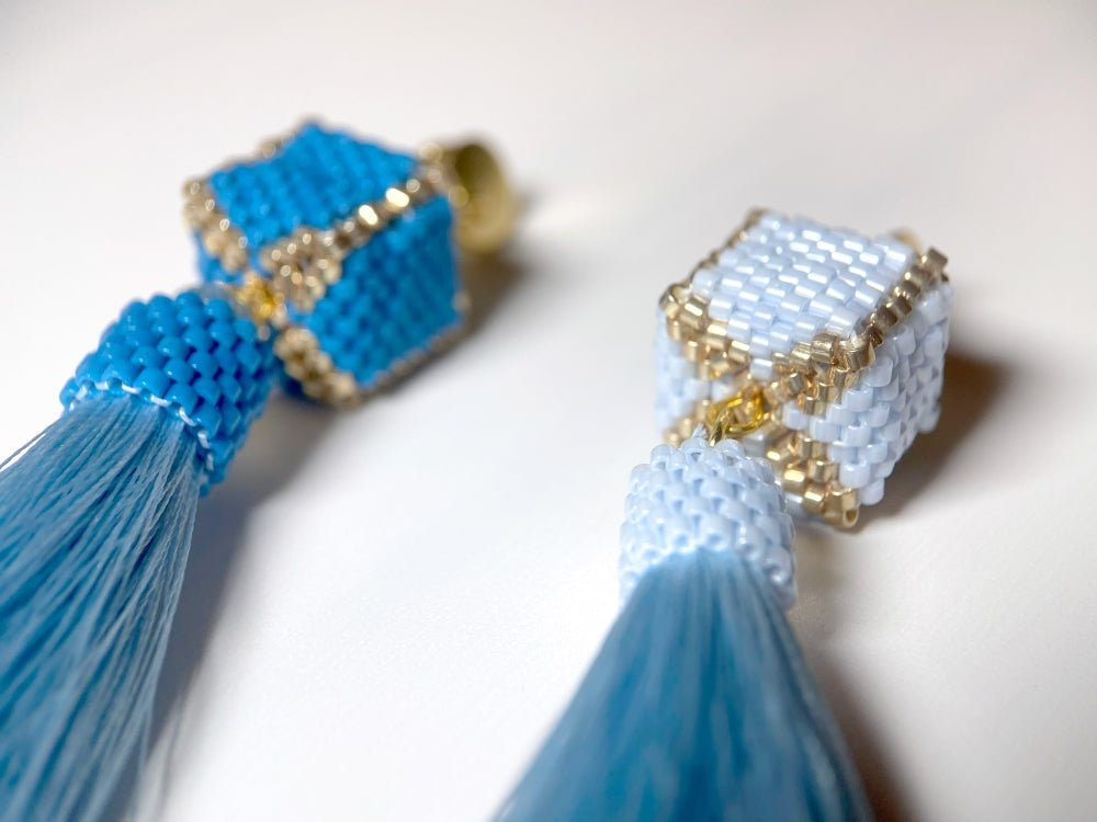 Handmade earrings in blue hues with cubic beads crafted in peyote technique accented with rayon tassels - Ornamentico shop