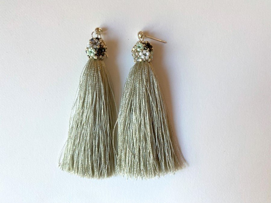 Handmade earrings are crafted from a shimmering mint tassel which is covered with a floral cap - Ornamentico shop