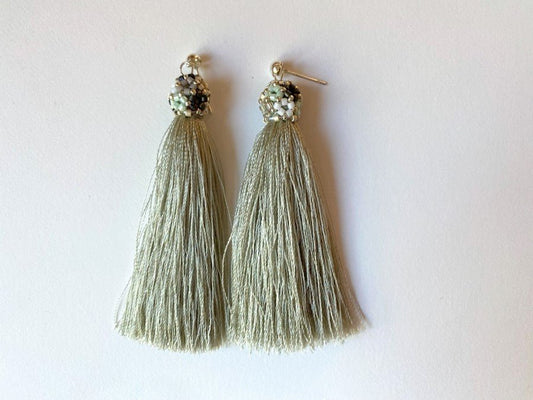 Handmade earrings are crafted from a shimmering mint tassel which is covered with a floral cap - Ornamentico shop
