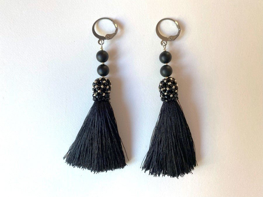 Handmade earrings are crafted from black tassels, covered with a floral cap made from Miyuki beads - Ornamentico shop