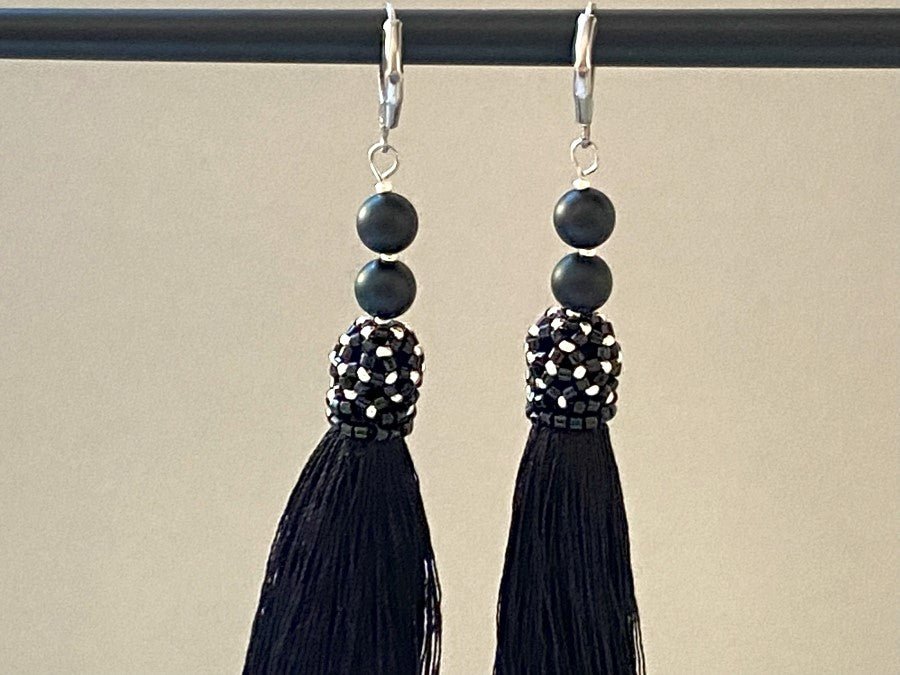 Handmade earrings are crafted from black tassels, covered with a floral cap made from Miyuki beads - Ornamentico shop