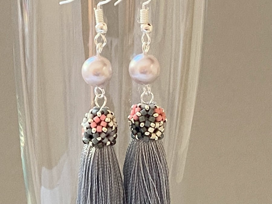 Handmade earrings are crafted from silver grey tassel which is covered with a floral cap from beads - Ornamentico shop