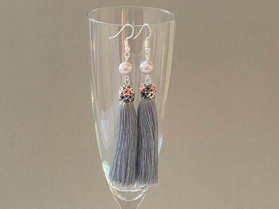Handmade earrings are crafted from silver grey tassel which is covered with a floral cap from beads - Ornamentico shop