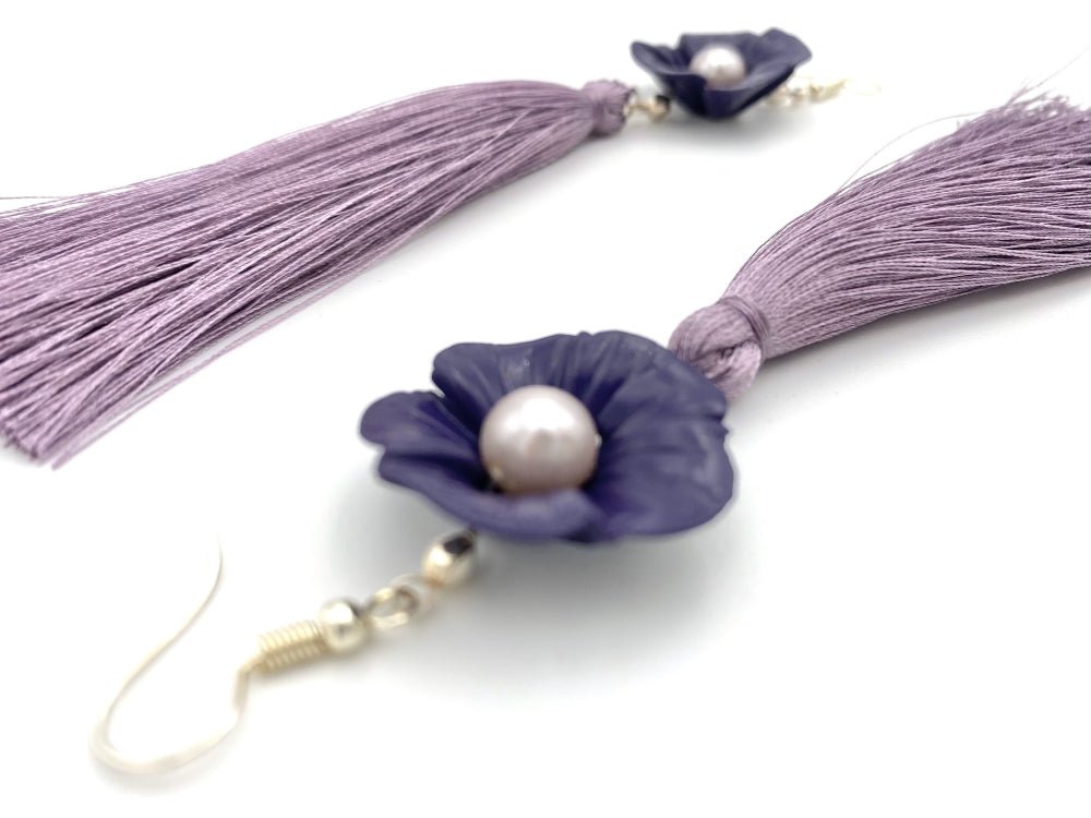 Handmade earrings featuring violet polymer clay flowers, river pearls and long rayon tassels - Ornamentico shop