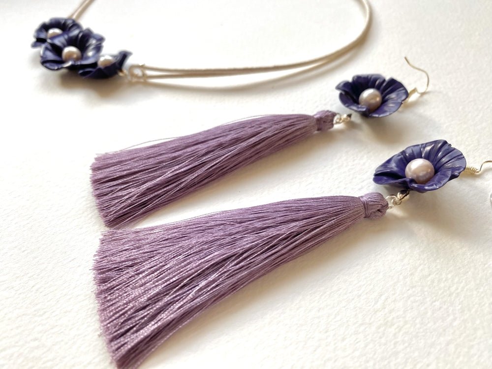 Handmade earrings featuring violet polymer clay flowers, river pearls and long rayon tassels - Ornamentico shop