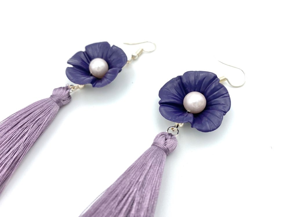 Handmade earrings featuring violet polymer clay flowers, river pearls and long rayon tassels - Ornamentico shop